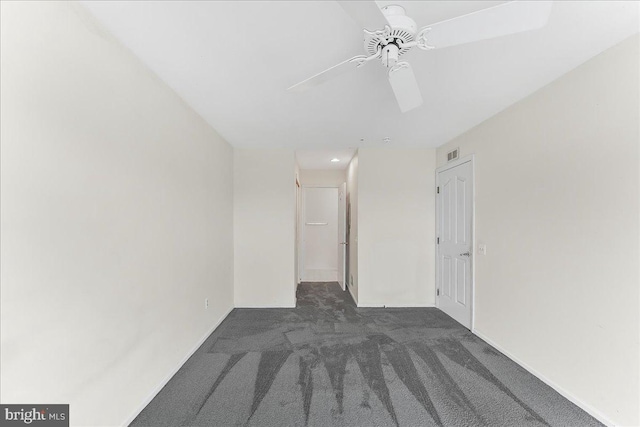 1707 Waters Edge Dr Unit 07, Newark, DE 19702 - spare room with dark colored carpet, ceiling fan, and baseboards