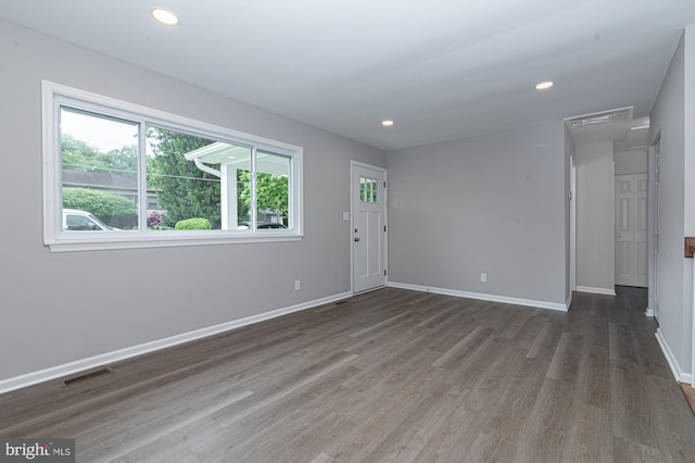 609 6th Ave, Brunswick, MD 21716 - unfurnished living room with wood finished floors, baseboards, and recessed lighting
