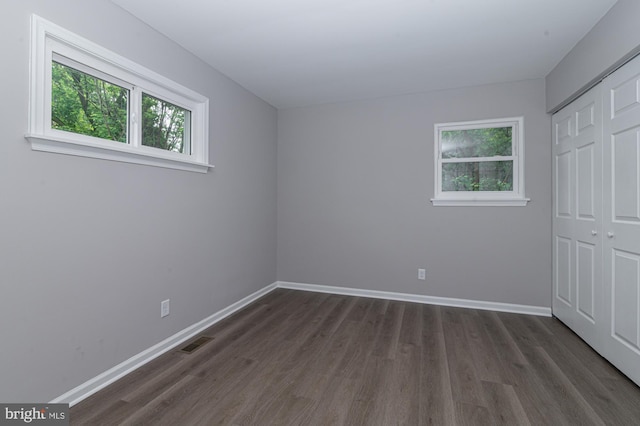 609 6th Ave, Brunswick, MD 21716 - unfurnished bedroom featuring dark wood-type flooring, a closet, and baseboards