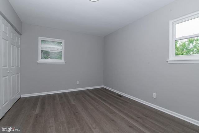 609 6th Ave, Brunswick, MD 21716 - unfurnished bedroom with a closet, dark wood finished floors, and baseboards