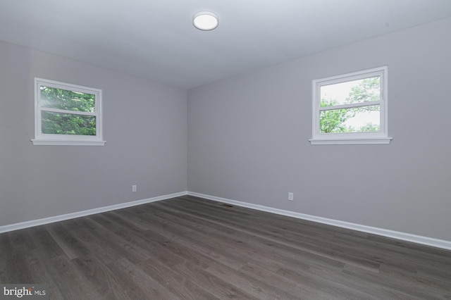 609 6th Ave, Brunswick, MD 21716 - unfurnished room featuring plenty of natural light, dark wood-style floors, and baseboards