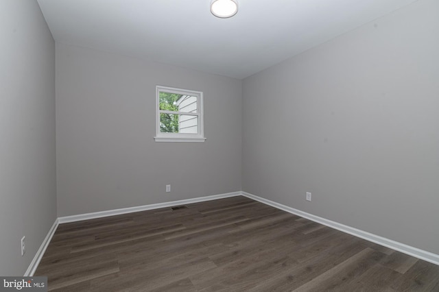 609 6th Ave, Brunswick, MD 21716 - empty room featuring dark wood-type flooring and baseboards