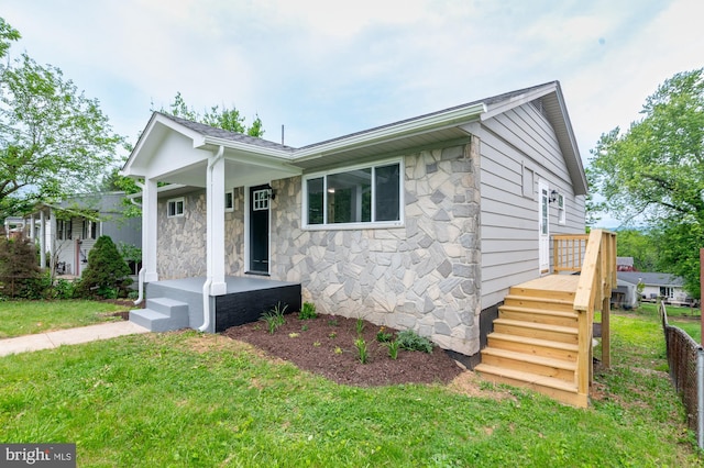 609 6th Ave, Brunswick, MD 21716 - view of front of house featuring a front lawn and stone siding