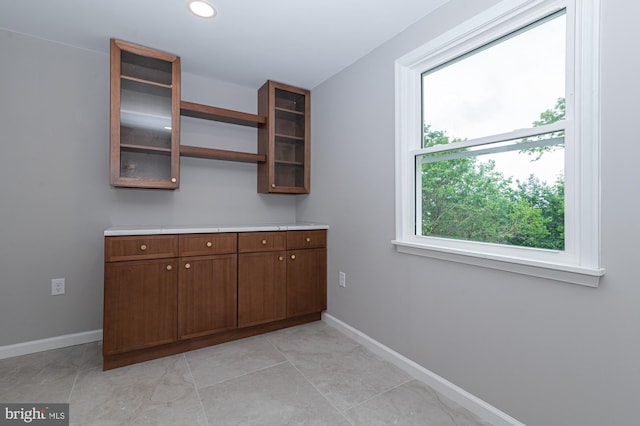 609 6th Ave, Brunswick, MD 21716 - laundry area with plenty of natural light, baseboards, recessed lighting, and light tile patterned floors