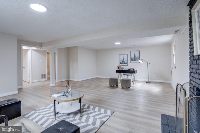 7923 Karl Rd, Alexandria, VA 22308 - living area with a textured ceiling, light wood-style floors, baseboards, and recessed lighting