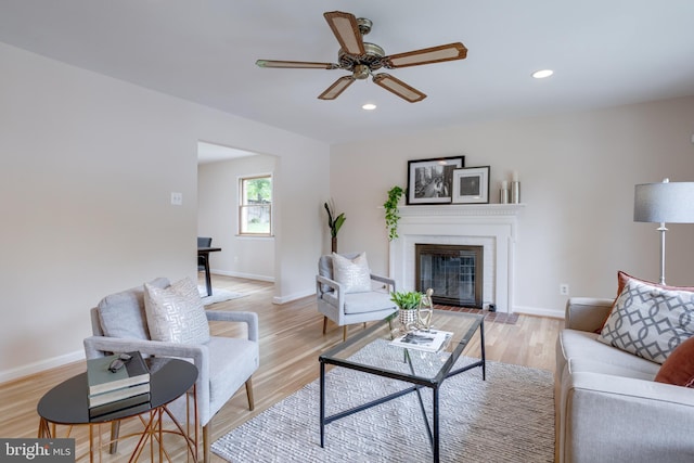 7923 Karl Rd, Alexandria, VA 22308 - living room with a ceiling fan, a fireplace with flush hearth, recessed lighting, baseboards, and light wood-style flooring