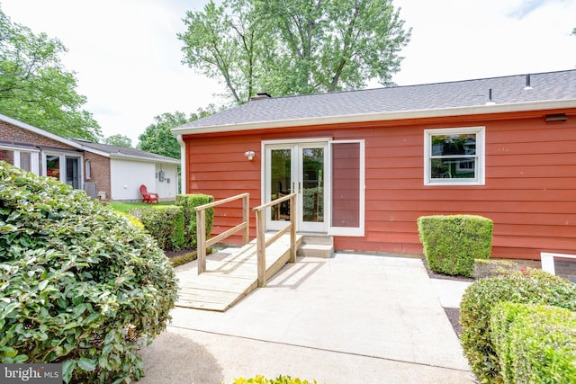 7923 Karl Rd, Alexandria, VA 22308 - entrance to property with a patio, french doors, and a shingled roof