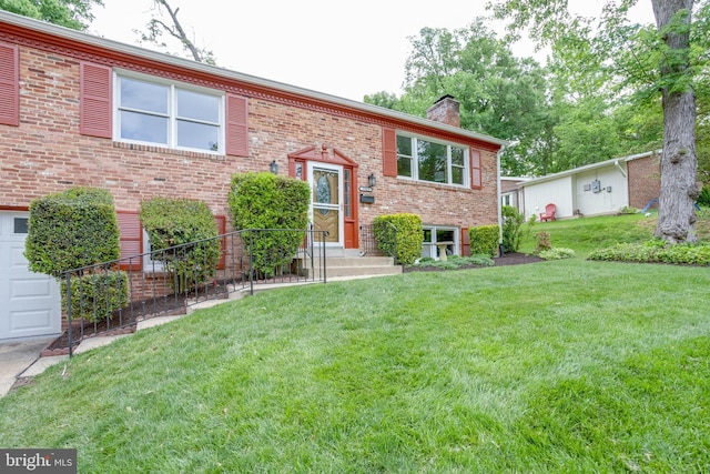 7923 Karl Rd, Alexandria, VA 22308 - split foyer home featuring a chimney, a front yard, and brick siding