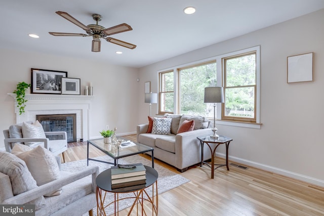 7923 Karl Rd, Alexandria, VA 22308 - living area with baseboards, ceiling fan, a fireplace, light wood-style floors, and recessed lighting