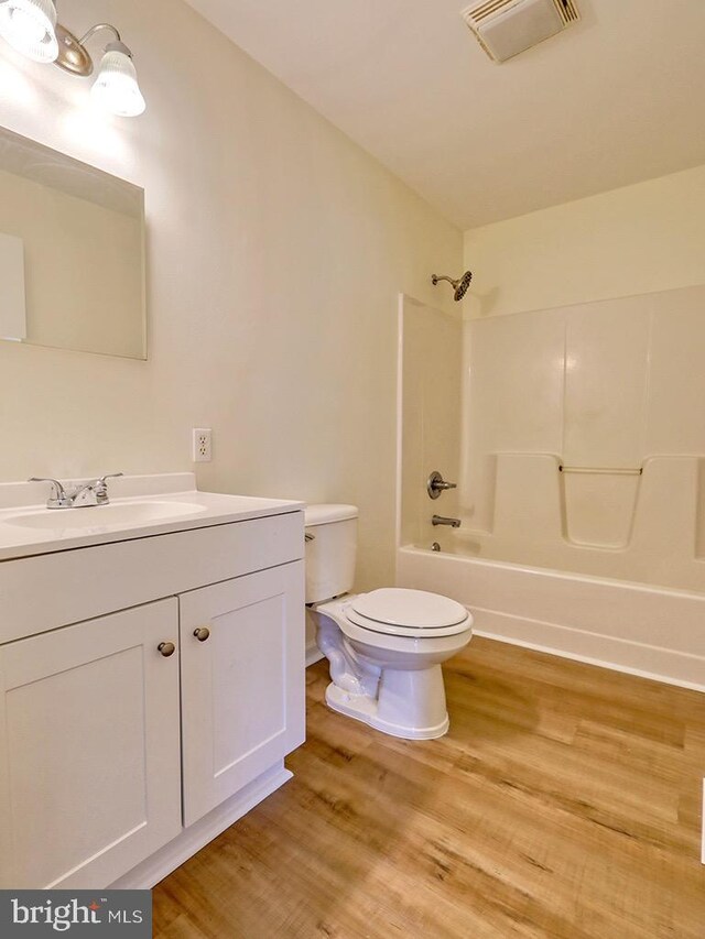 105 Sailor Ln, Milton, DE 19968 - full bathroom featuring toilet, wood finished floors, vanity, and shower / bath combination