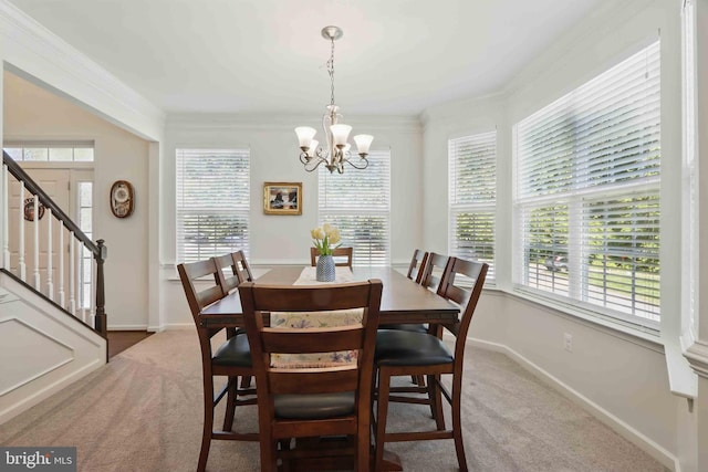 7571 Kindler Overlook Dr, Laurel, MD 20723 - dining space featuring light colored carpet, stairs, a chandelier, baseboards, and crown molding