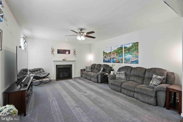 7571 Kindler Overlook Dr, Laurel, MD 20723 - living room with carpet flooring, ceiling fan, and a fireplace with flush hearth