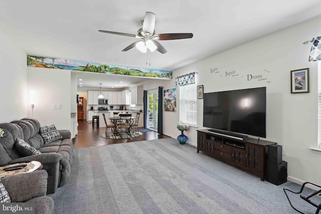 7571 Kindler Overlook Dr, Laurel, MD 20723 - living room with ceiling fan, baseboards, and dark carpet