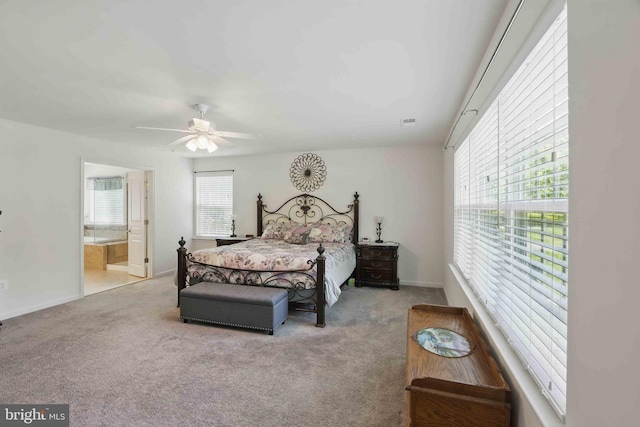 7571 Kindler Overlook Dr, Laurel, MD 20723 - carpeted bedroom with ensuite bathroom, ceiling fan, and baseboards