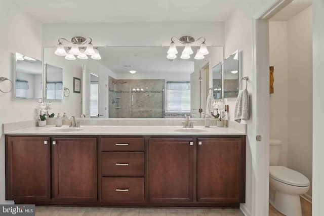 7571 Kindler Overlook Dr, Laurel, MD 20723 - bathroom featuring a shower stall, double vanity, a chandelier, and toilet