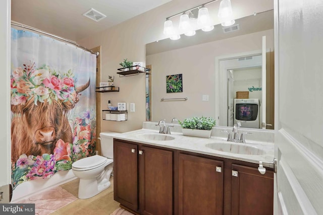 7571 Kindler Overlook Dr, Laurel, MD 20723 - full bathroom with double vanity, toilet, washer / clothes dryer, and tile patterned flooring