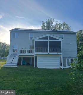 7571 Kindler Overlook Dr, Laurel, MD 20723 - back of house with stairs, a lawn, and a deck