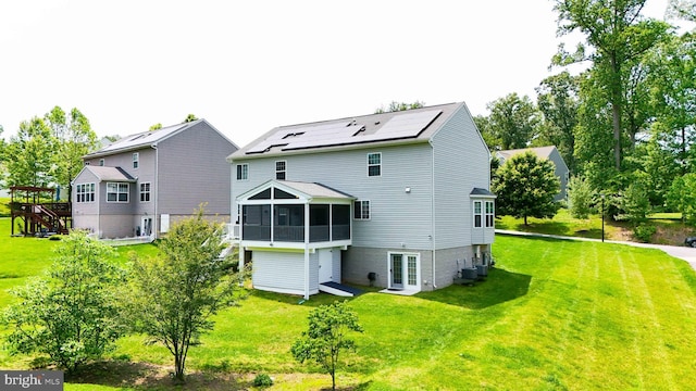 7571 Kindler Overlook Dr, Laurel, MD 20723 - rear view of property with a sunroom, a lawn, cooling unit, and solar panels