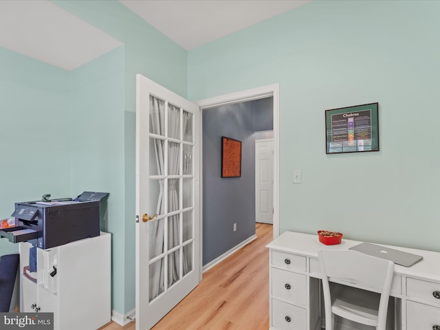 office space with light wood-type flooring