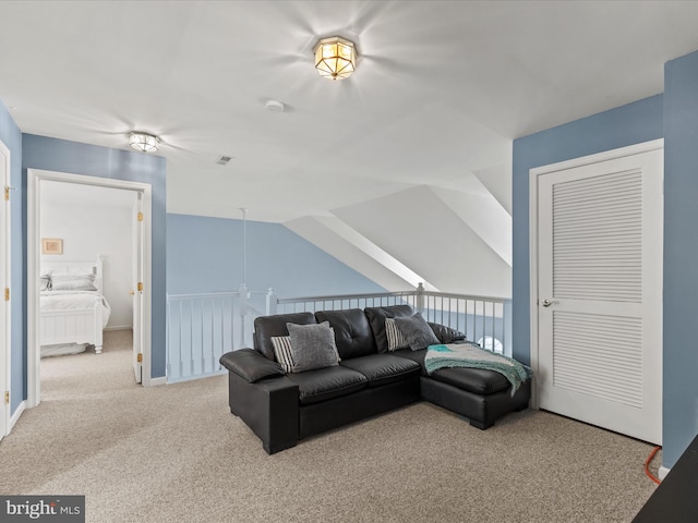 living area featuring carpet and vaulted ceiling