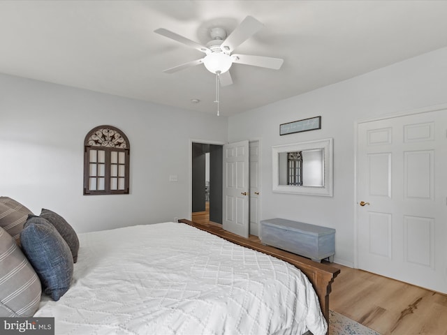 bedroom featuring wood finished floors and a ceiling fan