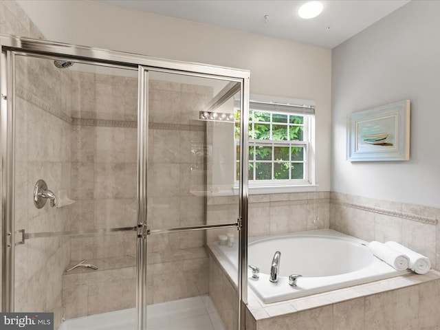 full bath with a shower stall and a bath