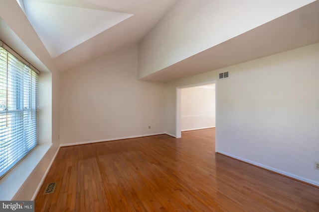 106 Girard Ave, Hatboro, PA 19040 - empty room featuring lofted ceiling, wood finished floors, and baseboards