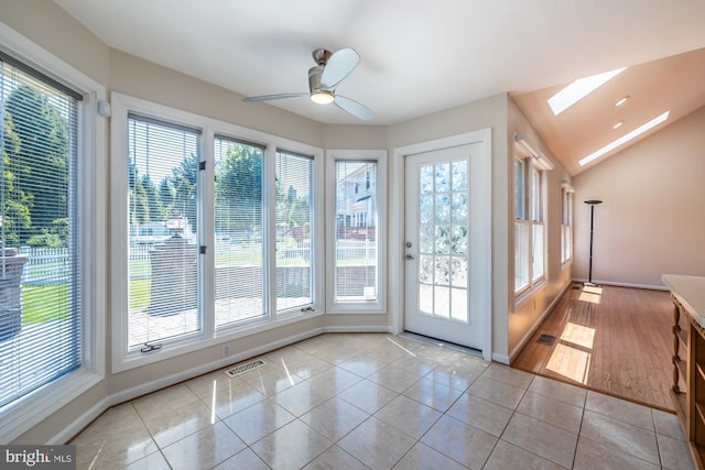 106 Girard Ave, Hatboro, PA 19040 - unfurnished sunroom featuring a skylight, plenty of natural light, tile patterned flooring, and baseboards