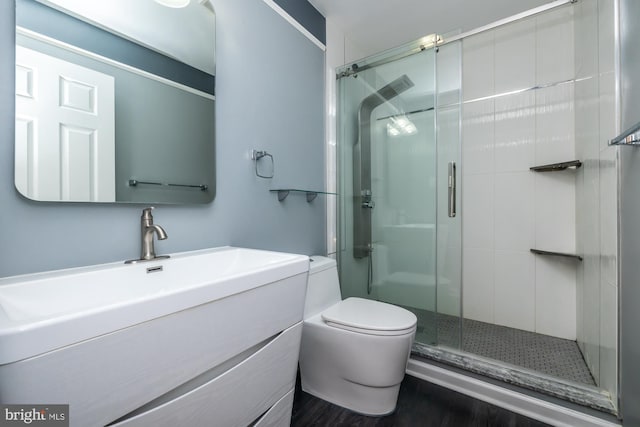 106 Girard Ave, Hatboro, PA 19040 - bathroom with a shower stall, vanity, toilet, and wood finished floors