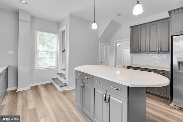 700 Strahle St, Philadelphia, PA 19111 - kitchen featuring stainless steel fridge with ice dispenser, gray cabinetry, light countertops, and light wood finished floors