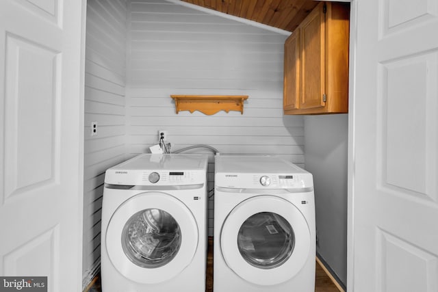 700 Strahle St, Philadelphia, PA 19111 - laundry area with cabinet space, washer and dryer, wood ceiling, and wood walls