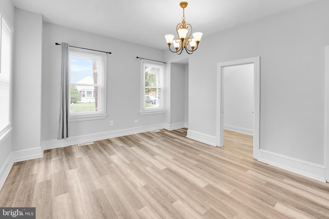 700 Strahle St, Philadelphia, PA 19111 - unfurnished dining area with a chandelier, light wood finished floors, and baseboards