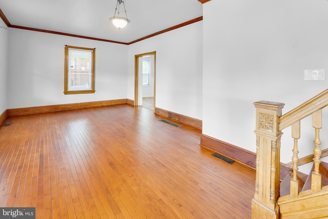 700 Strahle St, Philadelphia, PA 19111 - empty room featuring baseboards, crown molding, hardwood / wood-style floors, and stairs