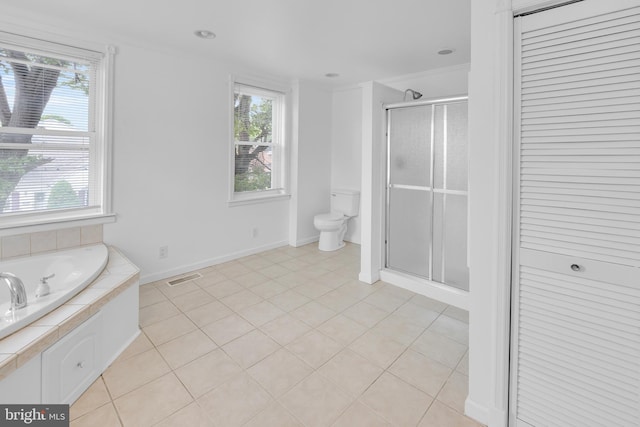 700 Strahle St, Philadelphia, PA 19111 - full bathroom featuring toilet, a shower stall, tile patterned flooring, a garden tub, and baseboards