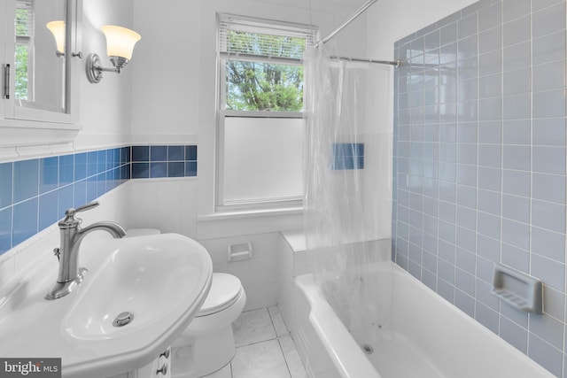 700 Strahle St, Philadelphia, PA 19111 - bathroom with a sink, shower / bathtub combination with curtain, tile walls, tile patterned flooring, and toilet