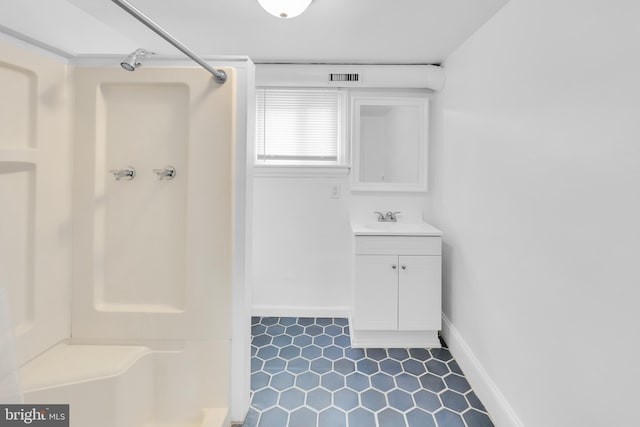 700 Strahle St, Philadelphia, PA 19111 - bathroom with a shower, tile patterned floors, vanity, and baseboards