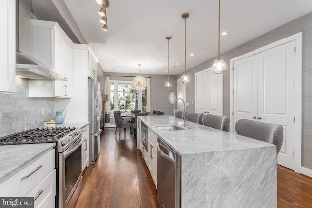 3811 New Hampshire Ave NW Unit 1, Washington, DC 20011 - kitchen featuring stainless steel appliances, wall chimney exhaust hood, a large island, white cabinets, and dark wood-style floors