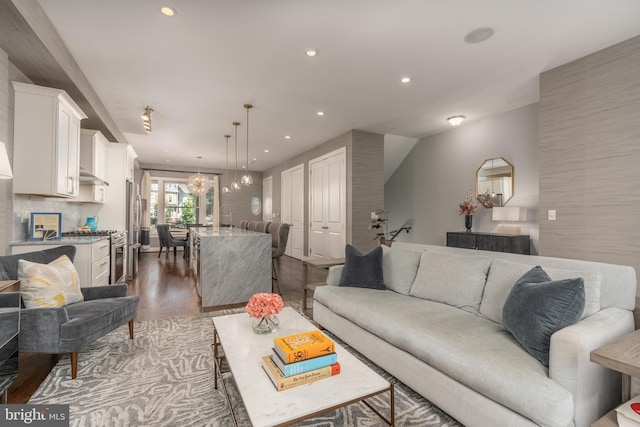 3811 New Hampshire Ave NW Unit 1, Washington, DC 20011 - living room with dark wood-style flooring, recessed lighting, and a chandelier