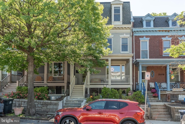 3811 New Hampshire Ave NW Unit 1, Washington, DC 20011 - view of front of house with stairway, mansard roof, covered porch, and brick siding