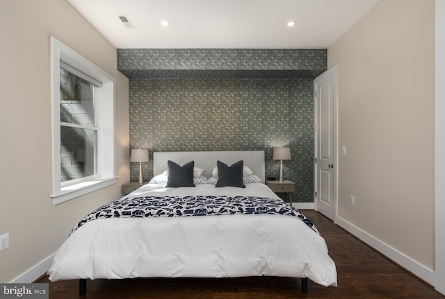 3811 New Hampshire Ave NW Unit 1, Washington, DC 20011 - bedroom featuring wallpapered walls, dark wood-style floors, and recessed lighting