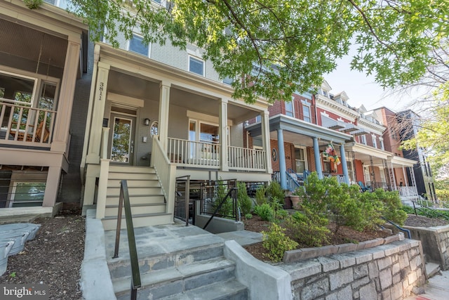3811 New Hampshire Ave NW Unit 1, Washington, DC 20011 - view of front of home featuring a porch, brick siding, and stairway