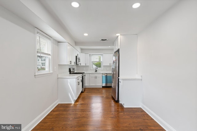 9606 Oak Summit Ave, Baltimore, MD 21234 - kitchen featuring appliances with stainless steel finishes, recessed lighting, baseboards, white cabinets, and light countertops