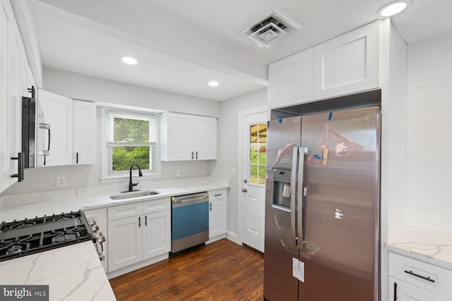 9606 Oak Summit Ave, Baltimore, MD 21234 - kitchen with stainless steel appliances, a sink, dark wood-style floors, light stone countertops, and recessed lighting
