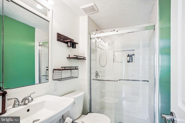 1559 Autumn Ridge Cir, Reston, VA 20194 - full bathroom featuring a sink, toilet, a shower stall, and a textured ceiling