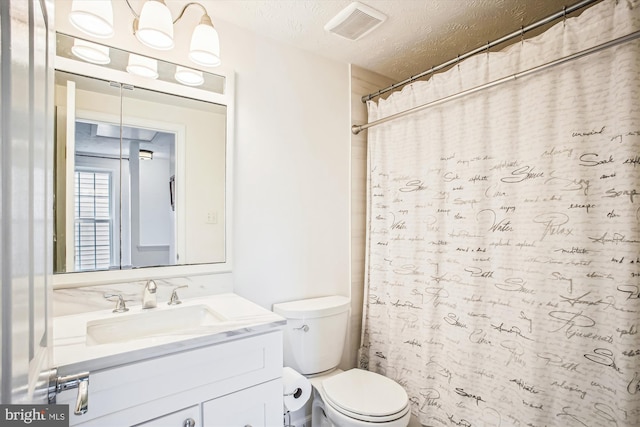 1559 Autumn Ridge Cir, Reston, VA 20194 - bathroom featuring toilet, vanity, a textured ceiling, and curtained shower