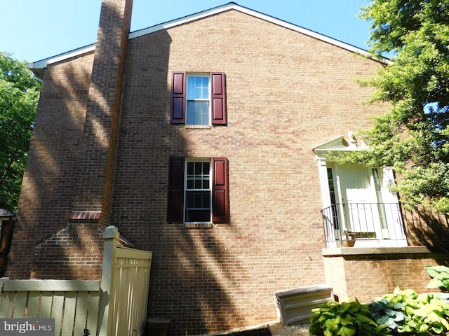 1559 Autumn Ridge Cir, Reston, VA 20194 - view of home's exterior with brick siding and a chimney