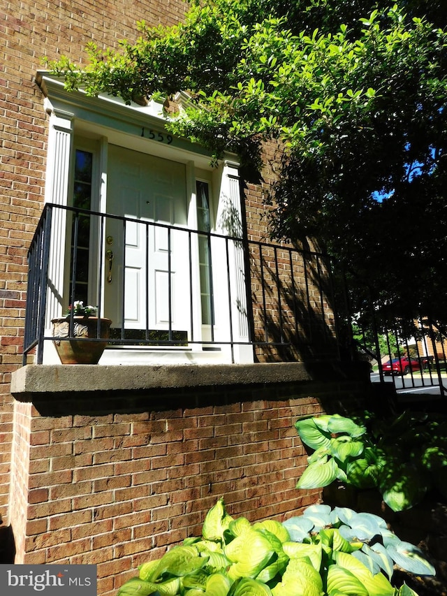 1559 Autumn Ridge Cir, Reston, VA 20194 - back of house with brick siding and a balcony