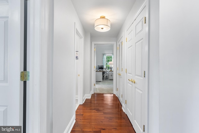 106 Debaran Ln, Bryn Mawr, PA 19010 - hallway featuring dark wood finished floors, baseboards, and a desk