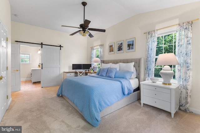 106 Debaran Ln, Bryn Mawr, PA 19010 - bedroom featuring light carpet, a barn door, baseboards, lofted ceiling, and a ceiling fan
