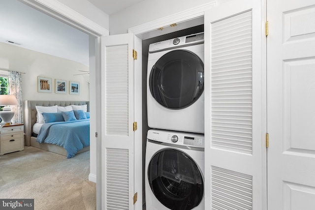106 Debaran Ln, Bryn Mawr, PA 19010 - clothes washing area featuring stacked washer and clothes dryer, carpet, and ceiling fan